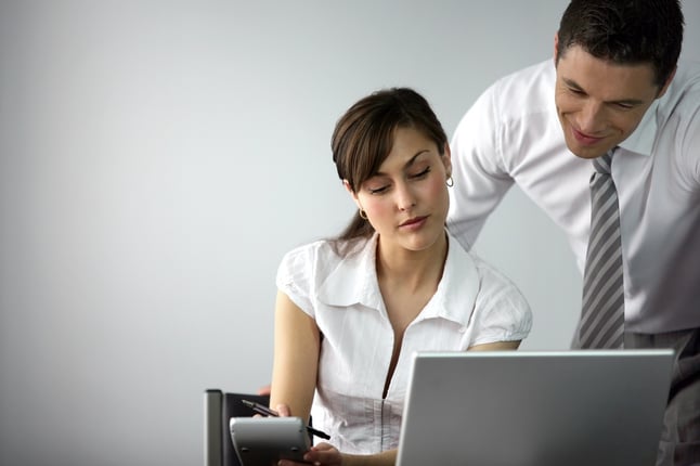 Male boss and female employee working 