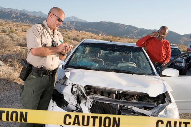 Police officer attending to the scene of a car accident