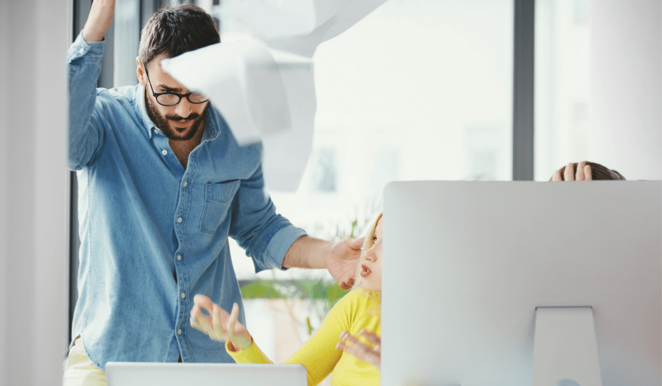 Man freaking out at a computer