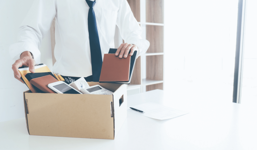 Man packing his work belongings