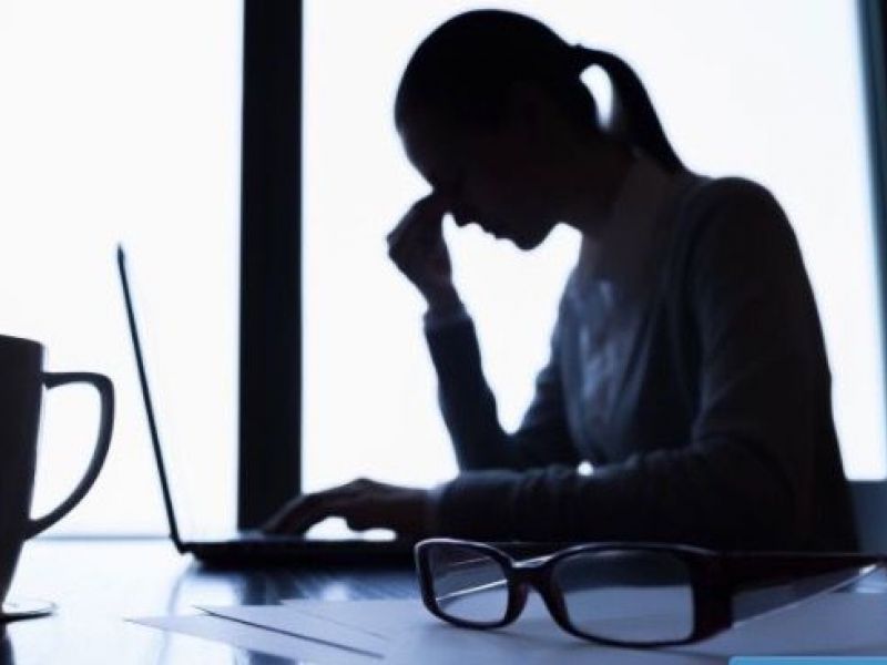 woman stressed by laptop