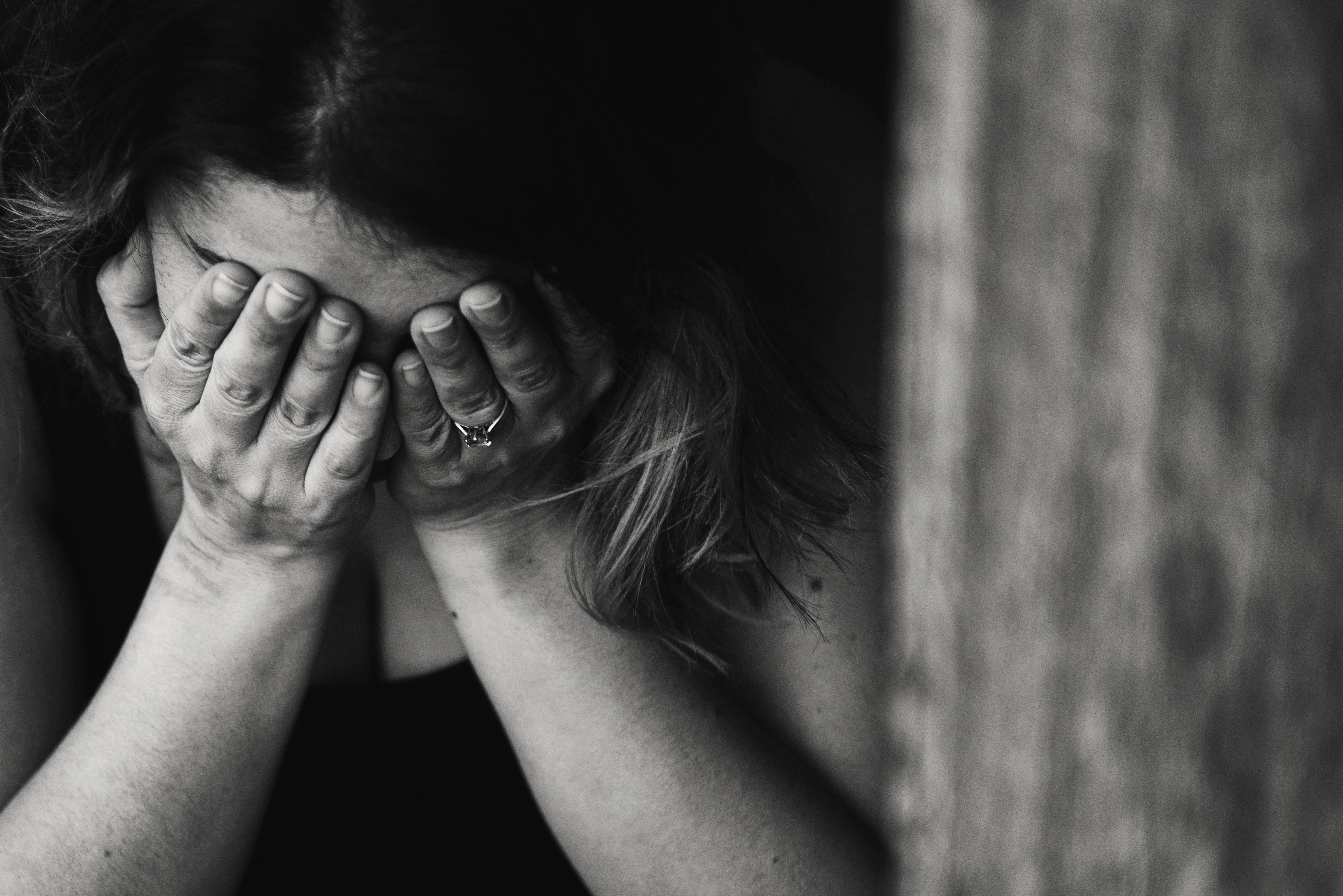 woman with face in hands