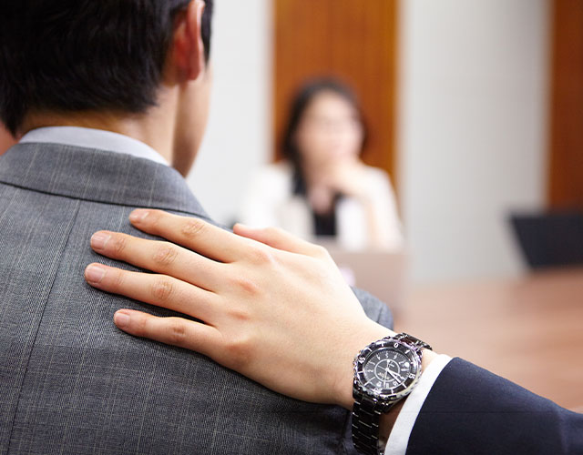 lawyer-hand-on-shoulder hand on shoulder