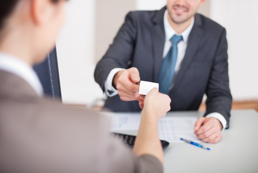 handing a business card