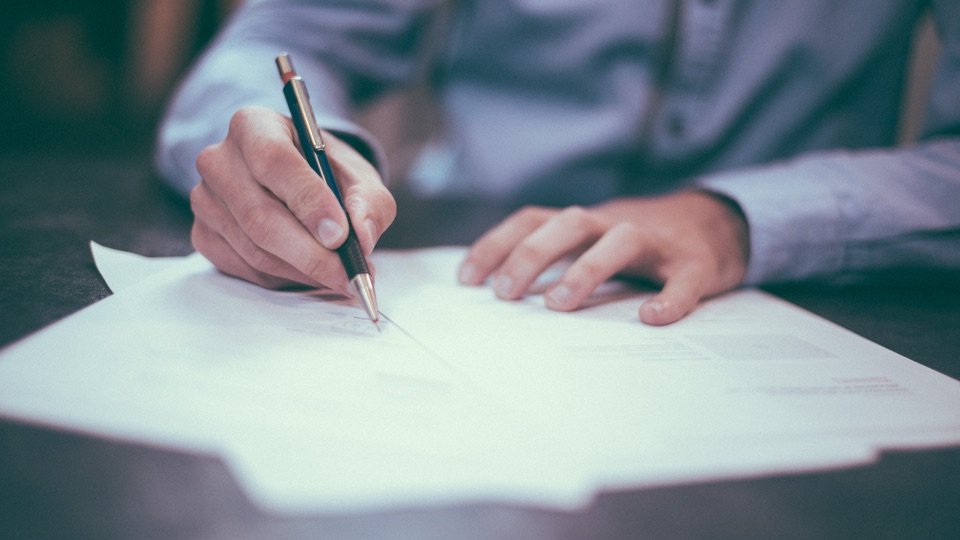 lawyer signing a document